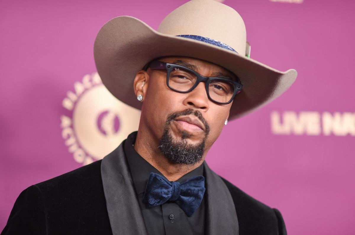 Host Kenny Burns in a cowboy hat and velvet bow tie on the BMAC Gala 2026 red carpet