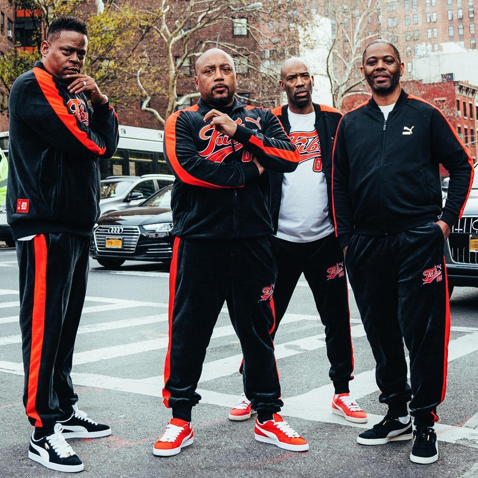 Daymond John and the founders of FUBU photographed together
