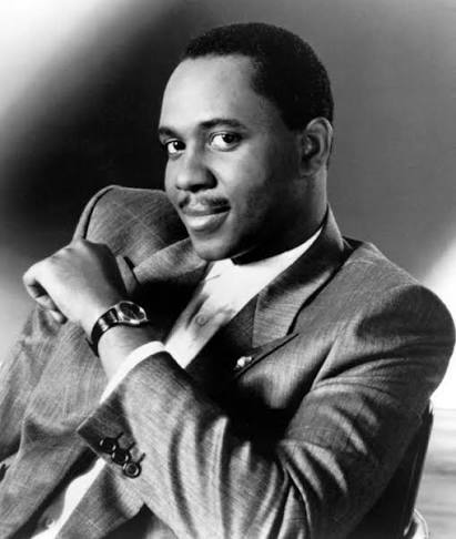 Black-and-white portrait of Freddie Jackson in a pinstriped suit jacket