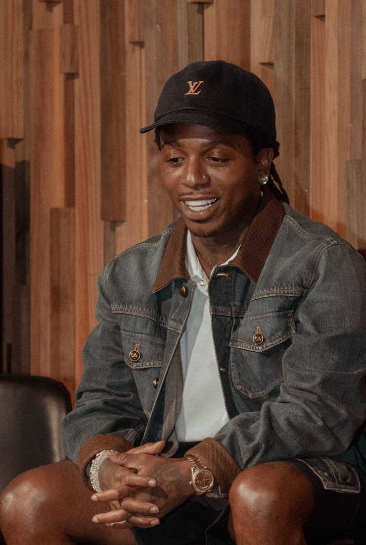 Close portrait of Jacquees in a denim jacket and cap during the Cover Conversations event.
