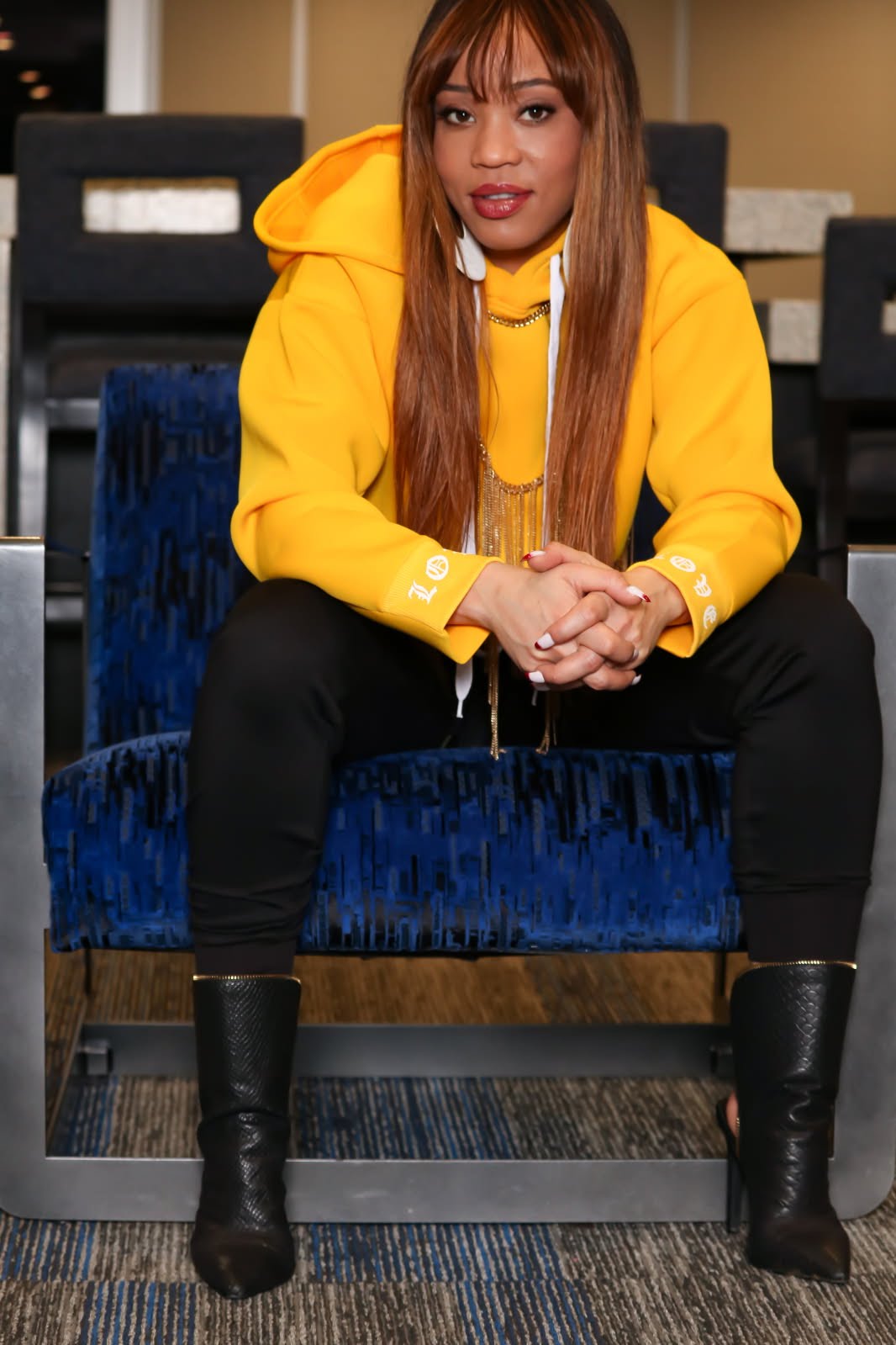LaTangela Newsome photographed in a yellow top for Black Beat Magazine.