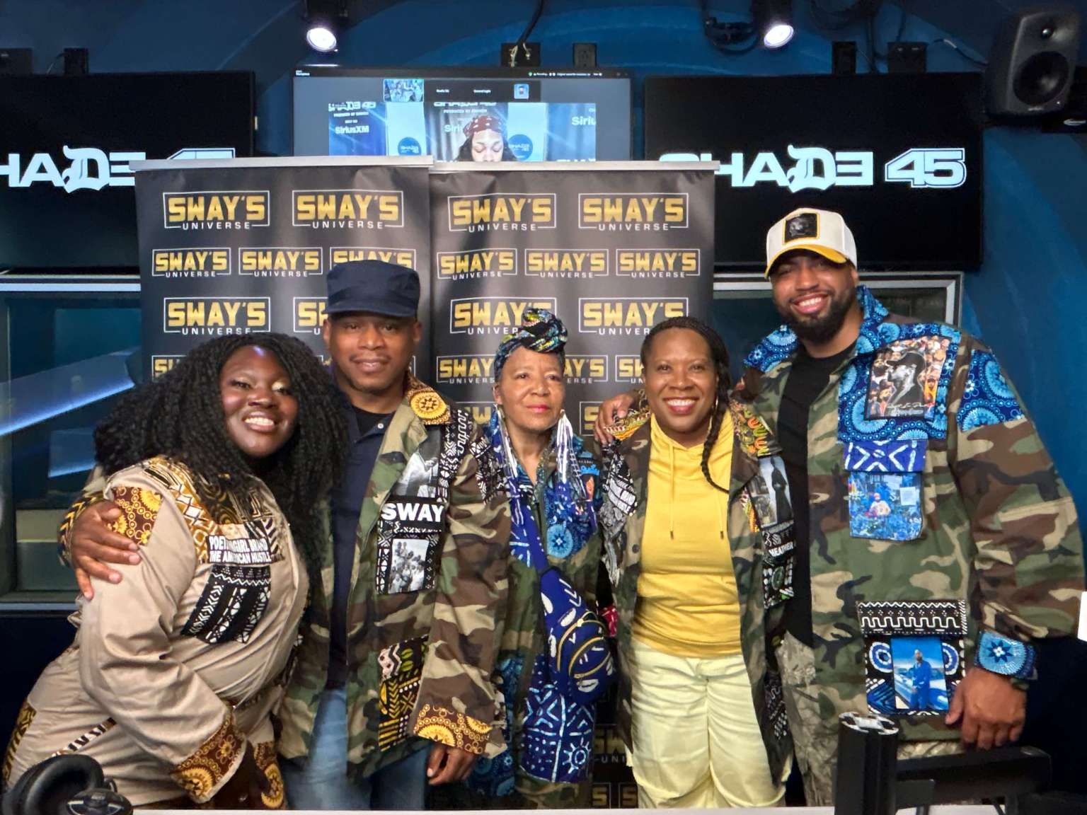 PoetRoniGirl and collaborators wearing her Army Couture jackets