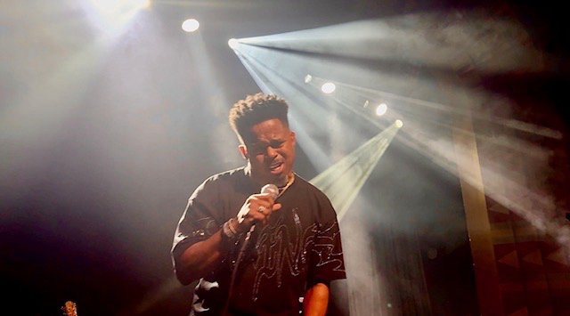 Walter E. Jones performing on stage as recording artist Tre Emanuel.